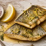 Recettes filets de loup poêlés au beurre citronné, sauce brillante et zeste de citron